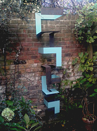 BLUE CLIMB  2017 200cm high x 35cm wide x 35cm deep Painted & rusted steel Private garden collection, UK